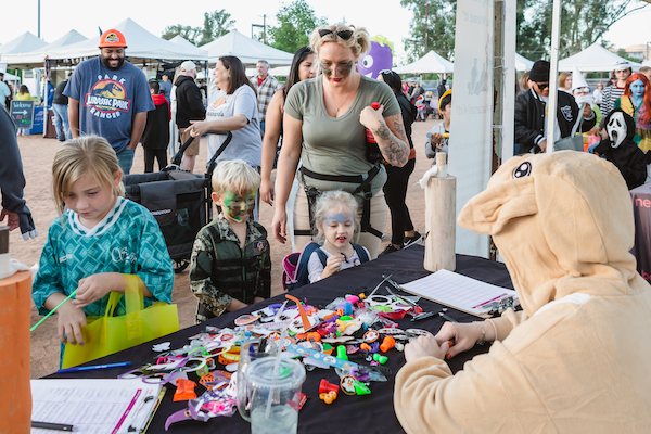 Kids collecting giveaways at a booth